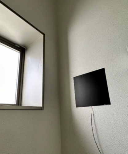 Large surface-mounted heat flux sensors on building interior